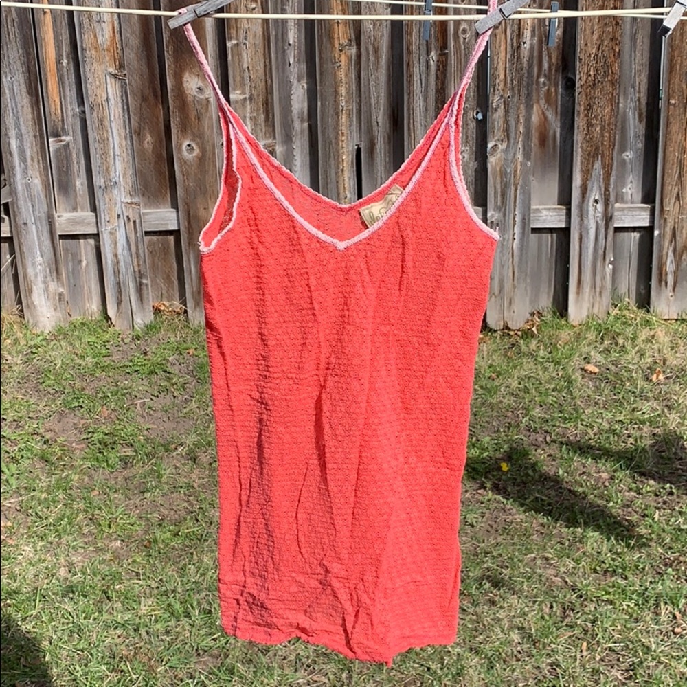 Coral colored camisole.